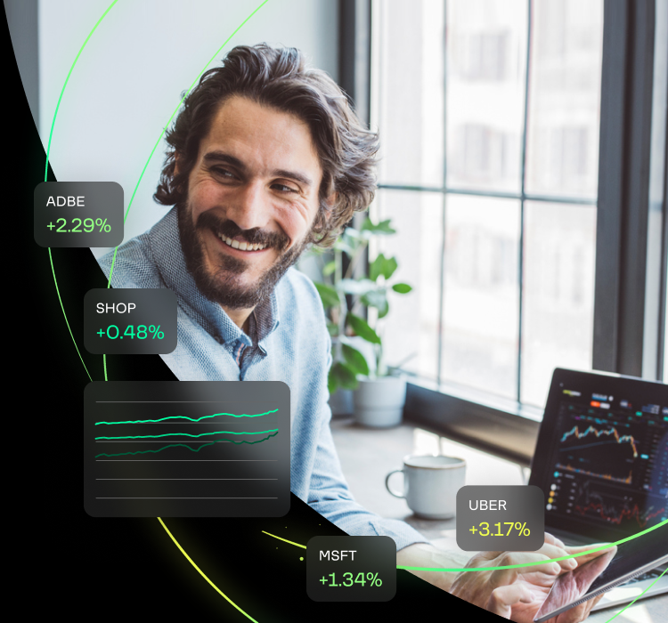 Fractional shares ticker symbols surrounding man checking the stock market